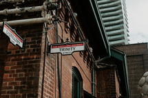 Trinity street sign on brick industrial building in the Distillery District in Toronto, Canada.