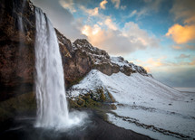waterfall and snowy landscape 