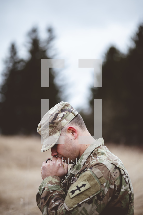 soldier with praying hands 