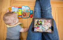 a mother, an infant, and an iPad 