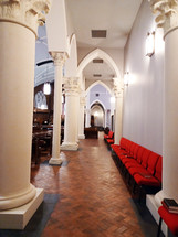 Traditional church with arches and red overflow chairs