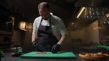 Professional Chef Is Cutting Prawns For Kitchen Service On Cruise Ship