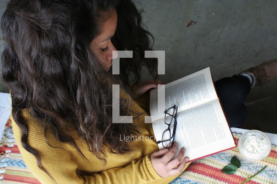 young woman reading a book 