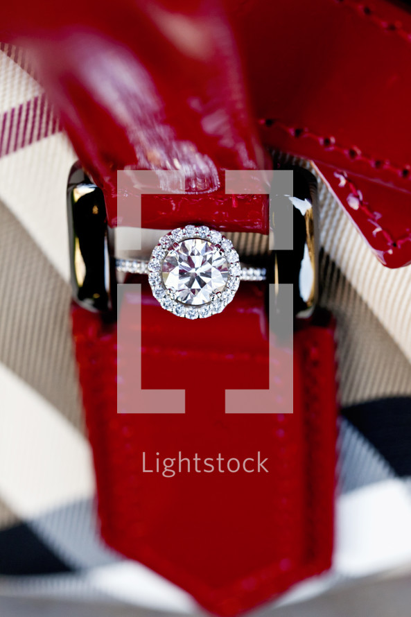 Diamond engagement ring hidden in red leather strap buckle wedding bride round 