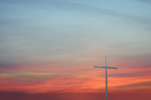 a cross at sunset 