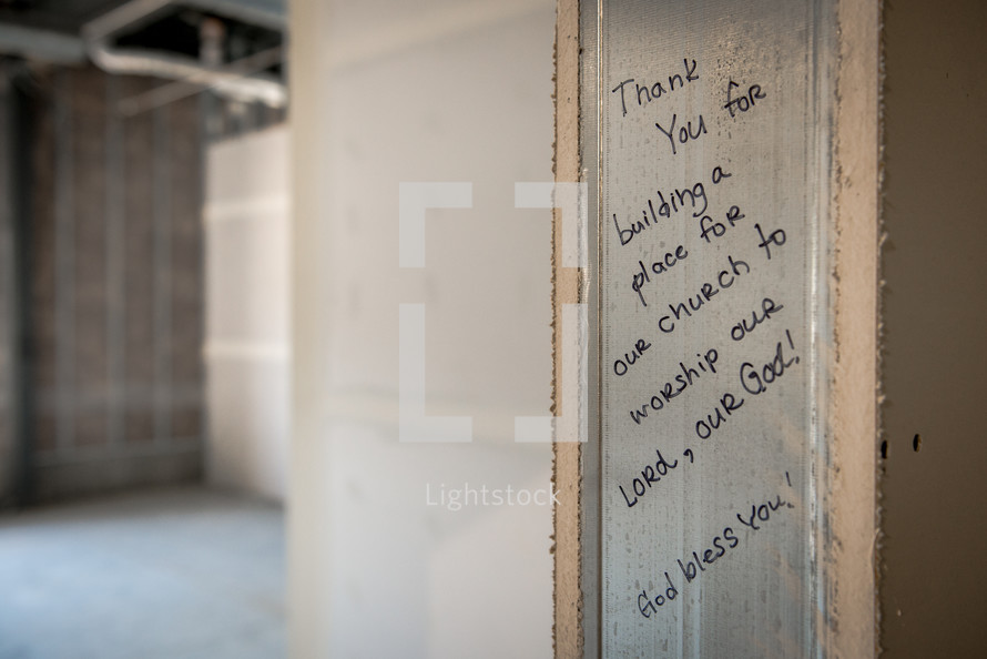 Inspirational and Godly message written on the door frame of a new church building being constructed. 