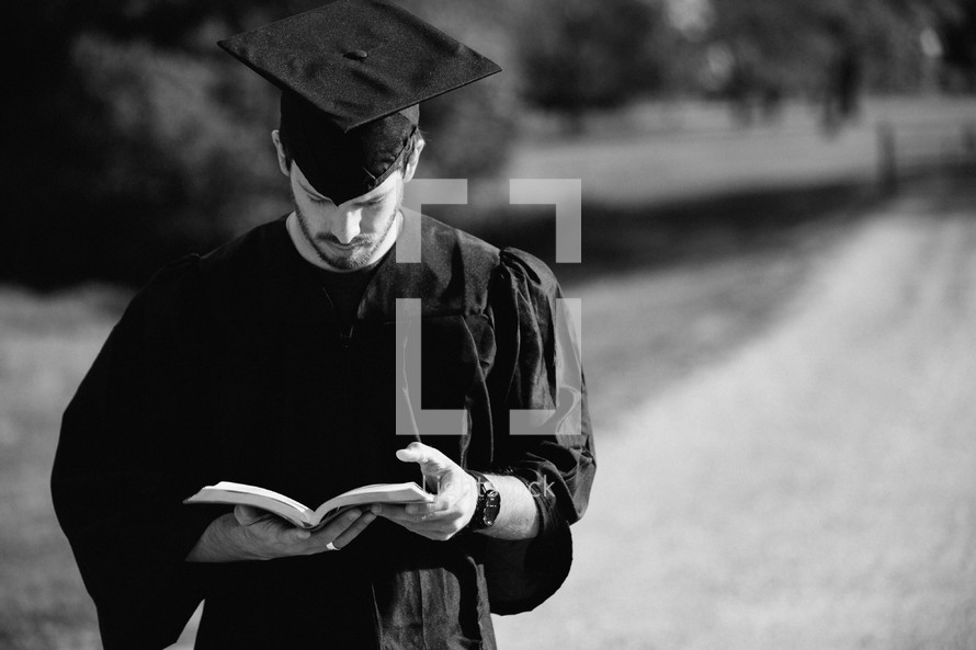 college graduate reading a Bible