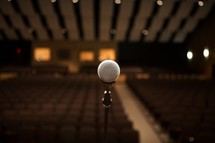 Microphone on stage in an empty auditorium