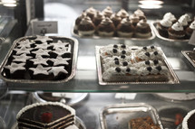 Desserts in a bakery display.