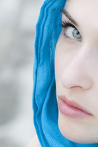 Lady Macbeth; woman with blue scarf looking toward camera.