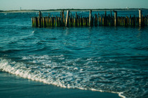 old pier pilings in the ocean 