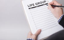 A Man Signing Up To Be in a Life Group