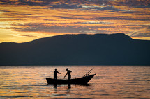 fishermen fishing at sunset 