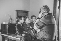 children listening to granddad 