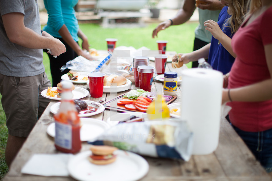 food on a table at an outdoor cookout 
