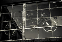 bicycle hanging in a shop window 