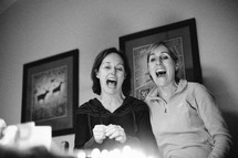 two women singing Happy Birthday 