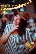 woman posing in a hat