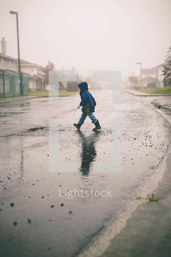 boy child crossing the street 