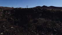 cross in a desert desert landscape 