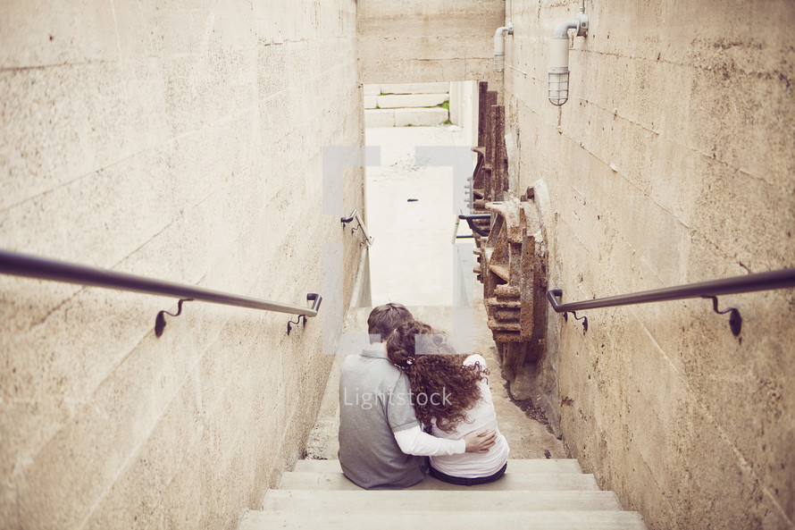 woman, man - embracing on stairwell, old buildings