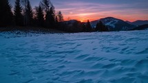 Beautiful sunrise in wild frozen nature in blue winter morning mountains landscape time lapse