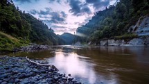 Fast stream water flow Whanganui River in wild nature New Zealand landscape Time lapse
