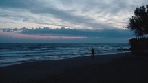 Photographer on the beach at sunset
