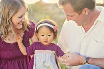 Couple with adopted baby girl