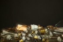 A cluster of lightbulbs isolated on black