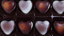 Valentines Day concept heart shaped chocolate background. Love concept. Dolly shot 4k