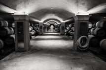 barrels of wine in a winery cellar underground wine cave