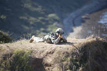 soldier aiming his rifle