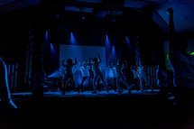 Dancers on a stage silhouette