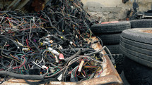 electrical cables to be recycled piled up in landfill 