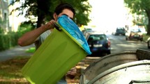 man throwing away trash