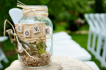 decorated mason jar with the word LOVE