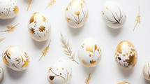 Gold and white painted floral Easter eggs.