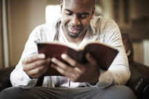 An African American man enjoying his Bible
