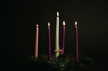 burning candles on an advent wreath 