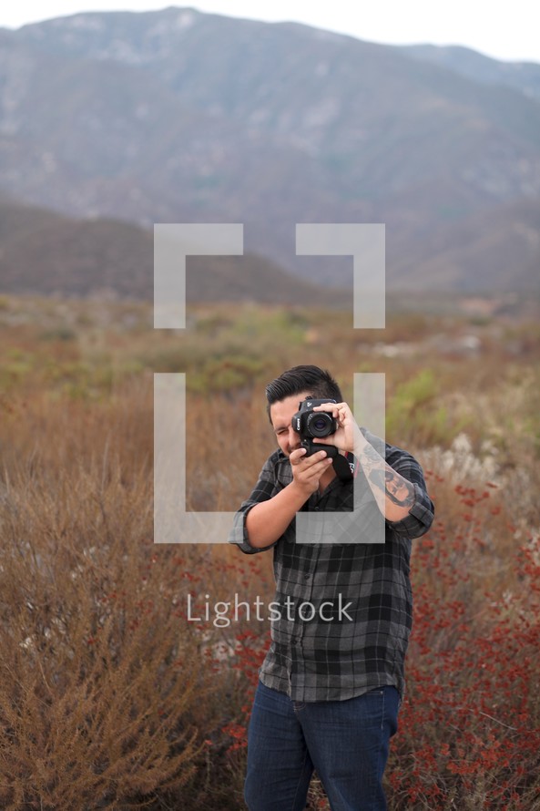 man taking a picture with a camera