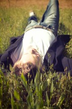 man lying in grass