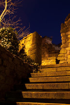 stairs leading to a collapsed stone wall