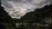 Clouds sky moving fast over Whanganui river in dark evening with stars in New Zealand nature Time-lapse
