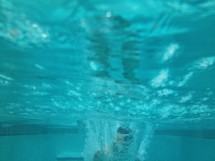 Man under pool water