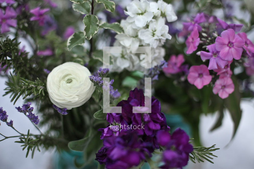 purple and white flowers in a vase