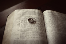 Wedding rings sitting on a bible