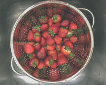 strawberries in a colander 
