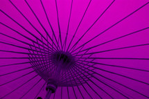 under a purple umbrella