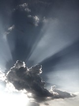 Light beams from a cloud shine forth 